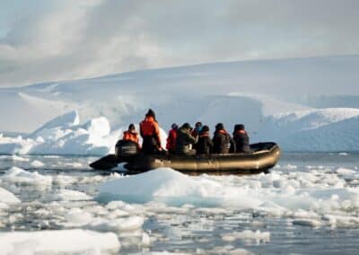 A fully loaded Zodiac surrounded by drifting ice floes