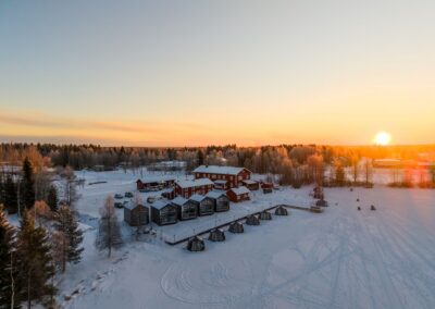 Panoramic view of the guesthouse, the glass igloo houseboats, and the Aurora Lake Lodges