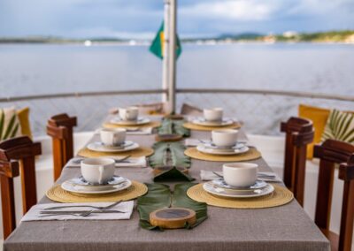 The Tupaiú's panoramic deck, featuring seating and a view of the Rio Tapajós
