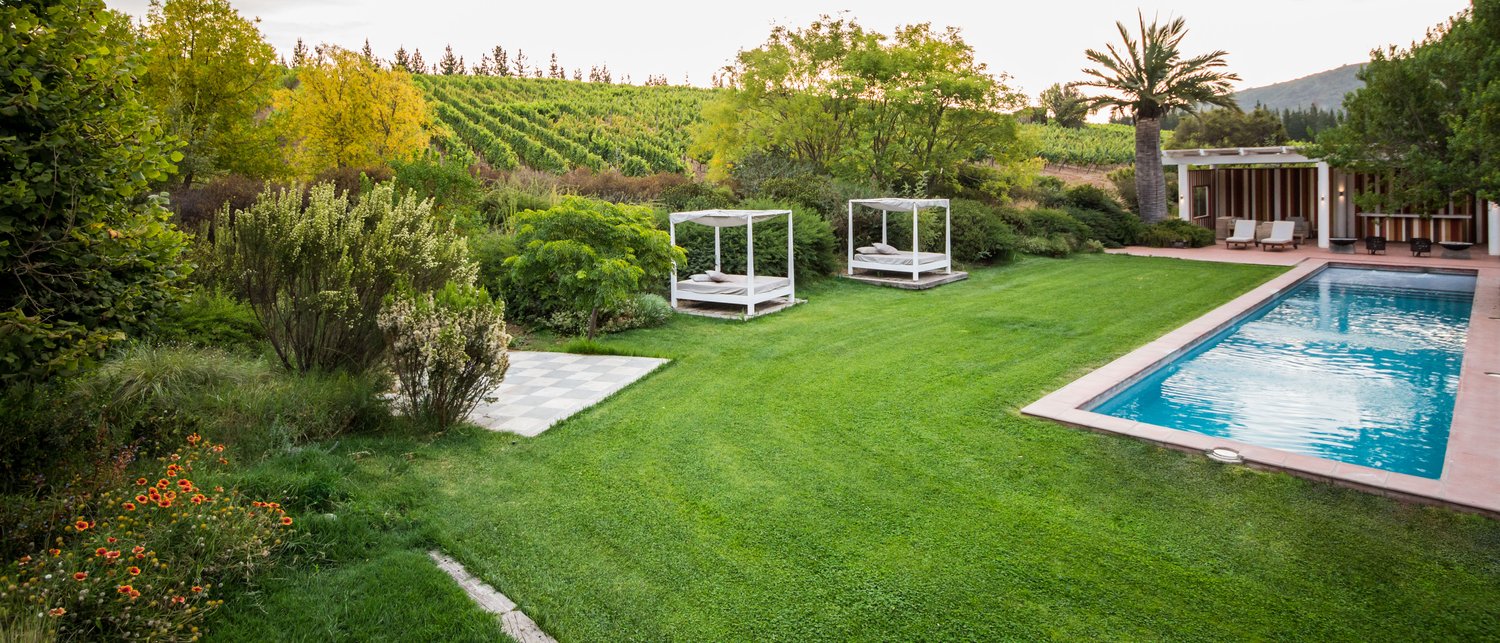 The pool at La Casona, nestled between the lawn and the vineyards