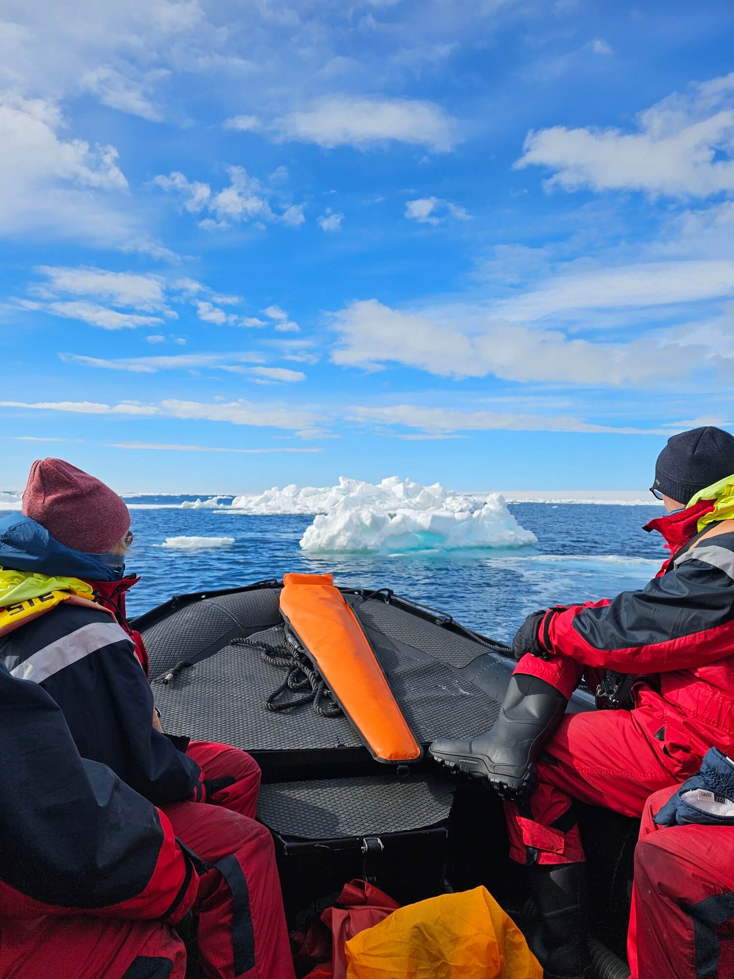 Guests in a Zodiac boat among ice floes