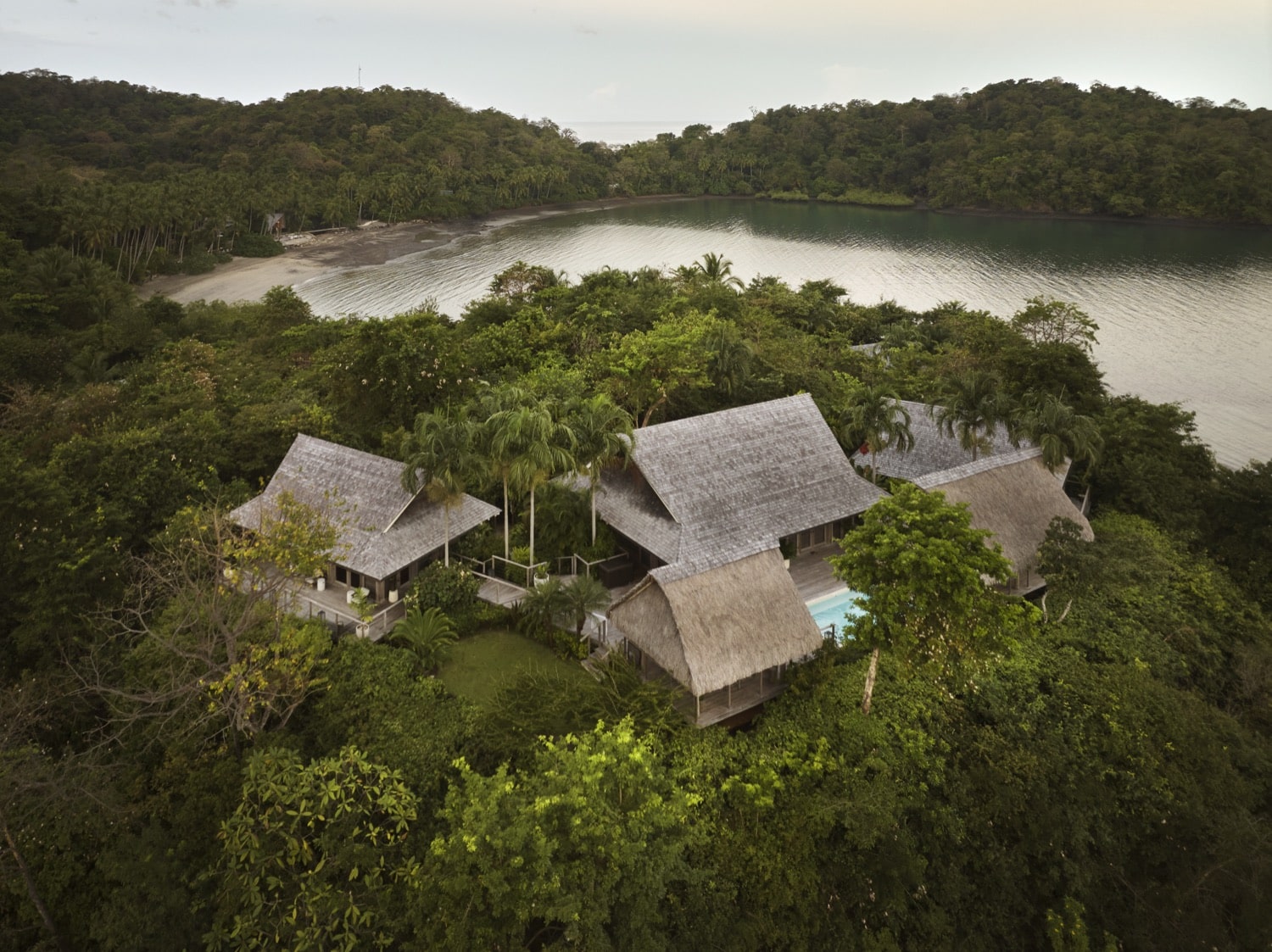 Aerial view of the four Casita Grande houses surrounding the patio and pool