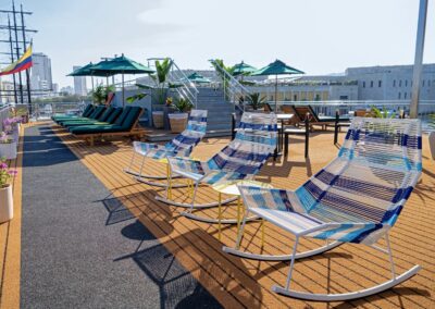 Rocking chairs, lounge chairs, and umbrellas on the AmaMagdalena's sun deck