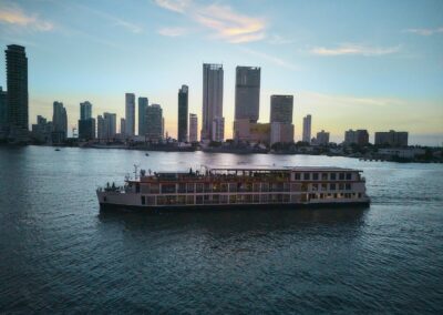 The AmaMelodia at dusk against the backdrop of Cartagena's high-rise skyline
