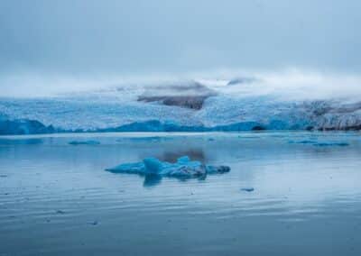 Glacier front with floating ice in the water in Greenland